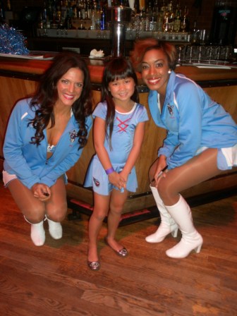Kasen with two of the Titans cheerleaders